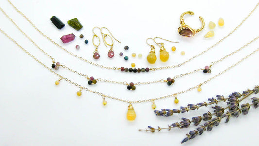 Handmade October birthstone jewelry featuring Ethiopian Opal and Tourmaline gemstones in sterling silver and 14k gold-filled designs.